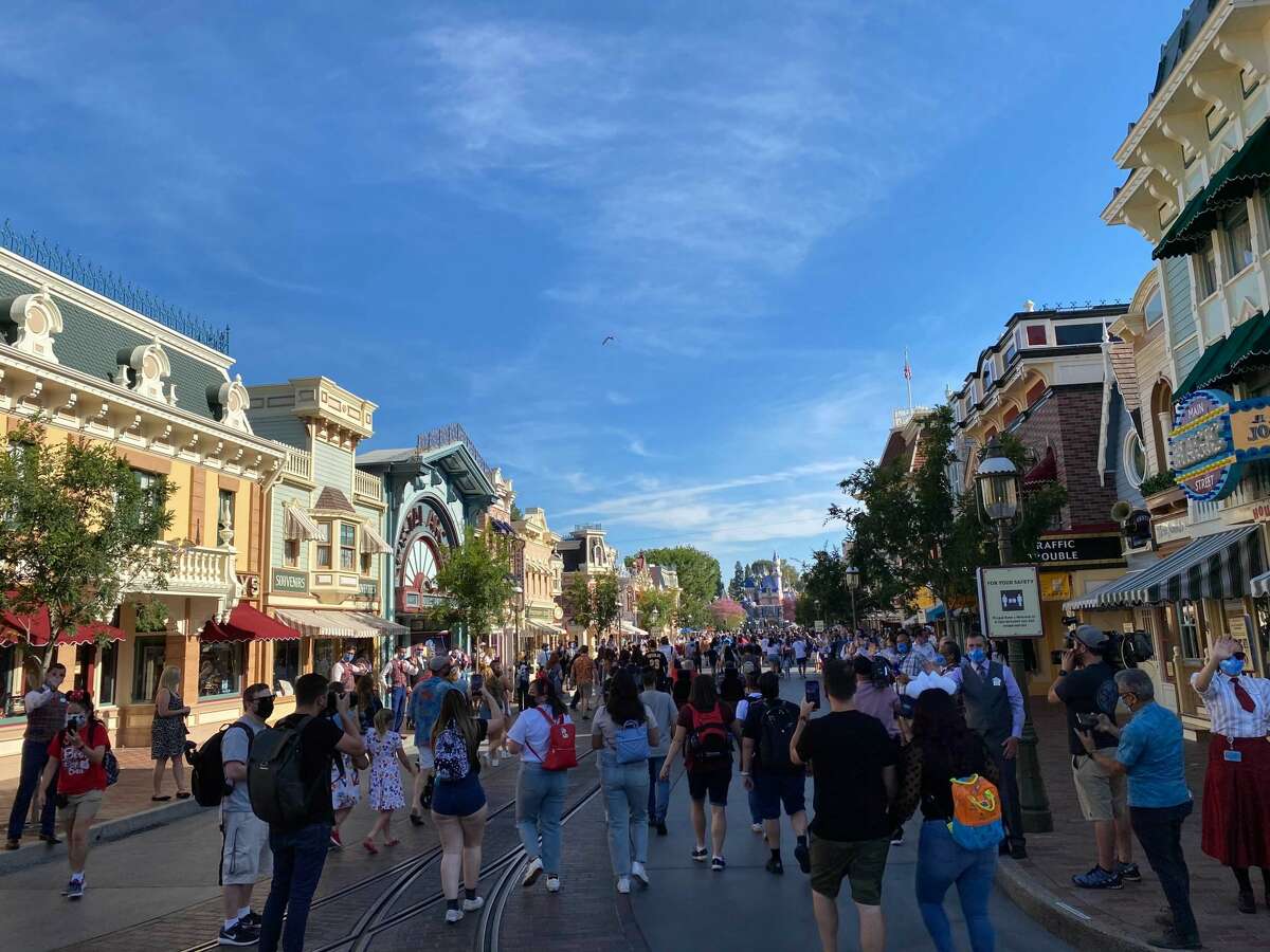 Visitors walked through Disneyland's Main Street on its reopening day.