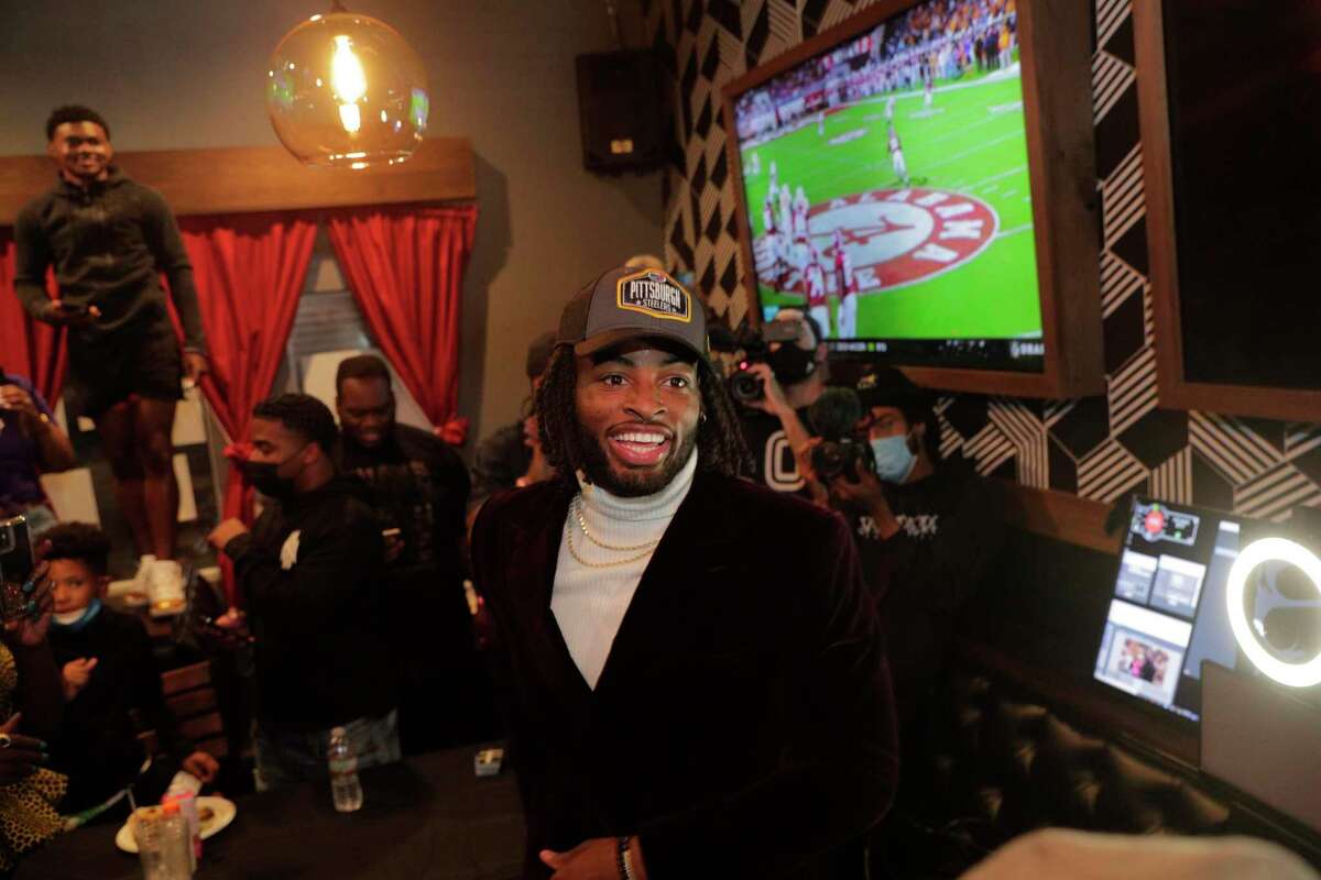 Najee Harris celebrates with family and friends after his selection in the 2021 NFL Draft at Rob Ben’s restaurant in Emeryville Calif., on Thursday, April 29, 2021. Harris was picked 24th overall by the Pittsburgh Steelers.