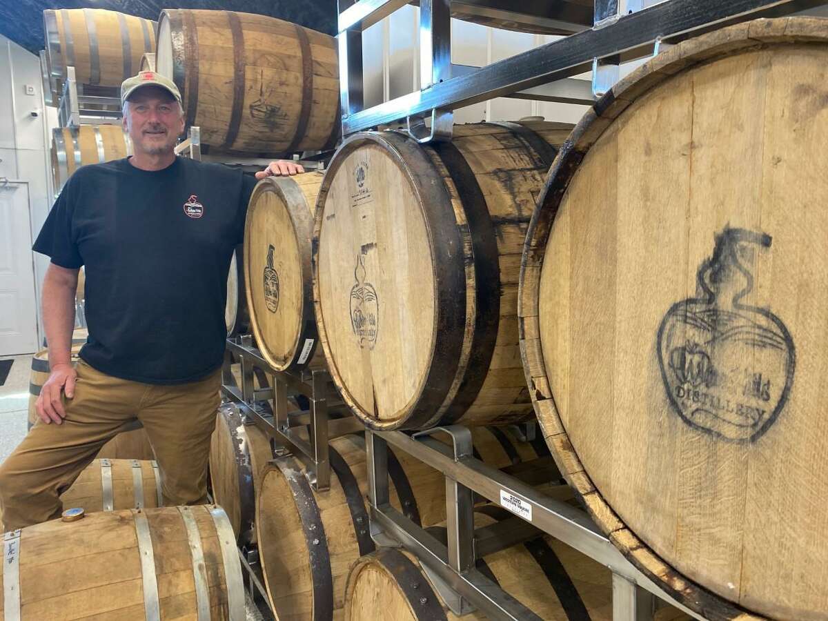 Dan Beardsley shows off the barrels lining the wall inside his new business, White Hills Distillery, located on his father's farm off Leavenworth Road. The distillery is to open in early June 2021.