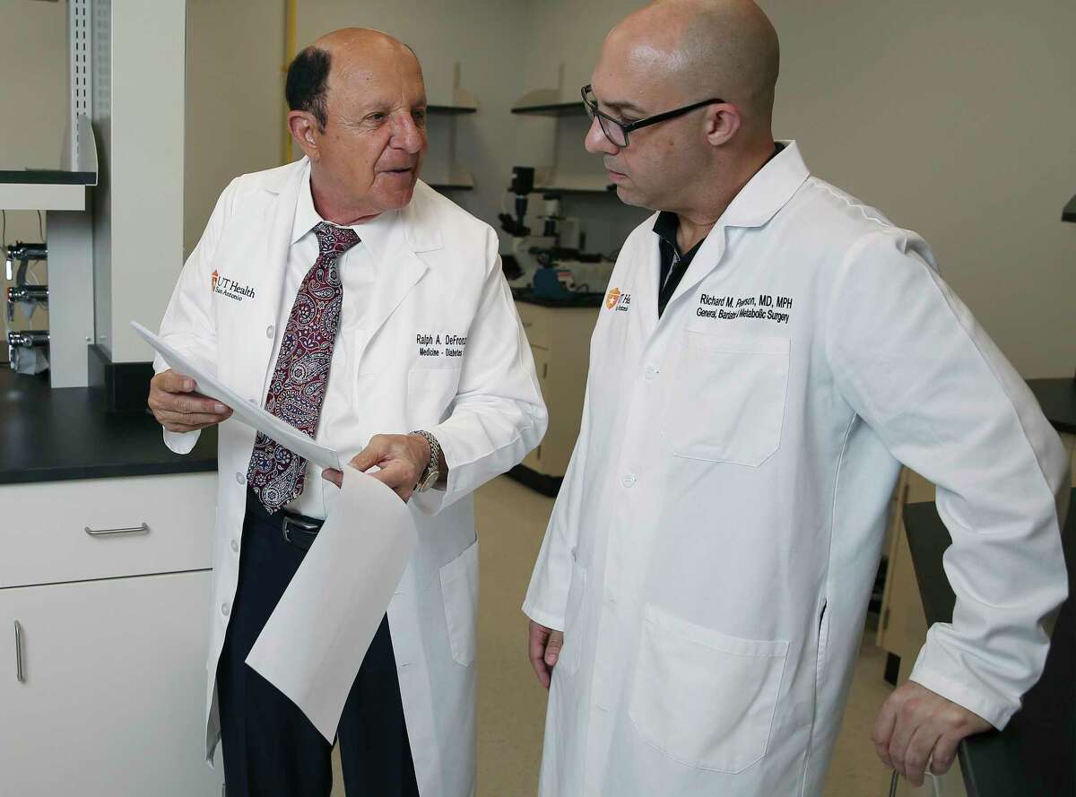 Dr. Ralph DeFronzo, left, and Dr. Richard Peterson from UT Health San Antonio are collaborating with a Pennsylvania ophthalmologist on a new surgical technique that may reverse or lessen the effects of Type 2 diabetes by removing fat from around the intestines.