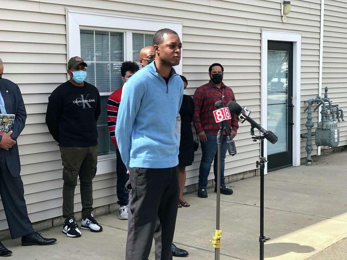 2Samod Rankins, a lieutenant with the New Haven Fire Department, speaks at a press conference Friday about the city's proposed lottery system to break a 99-way tie on the entrance exam for new firefighters.