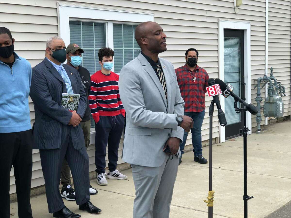 Ernest Jones, a lieutenant with the New Haven Fire Department and president of the New Haven Firebirds Society, speaks at a press conference Friday about the city's proposed lottery system to break a 99-way tie on the entrance exam for new firefighters.