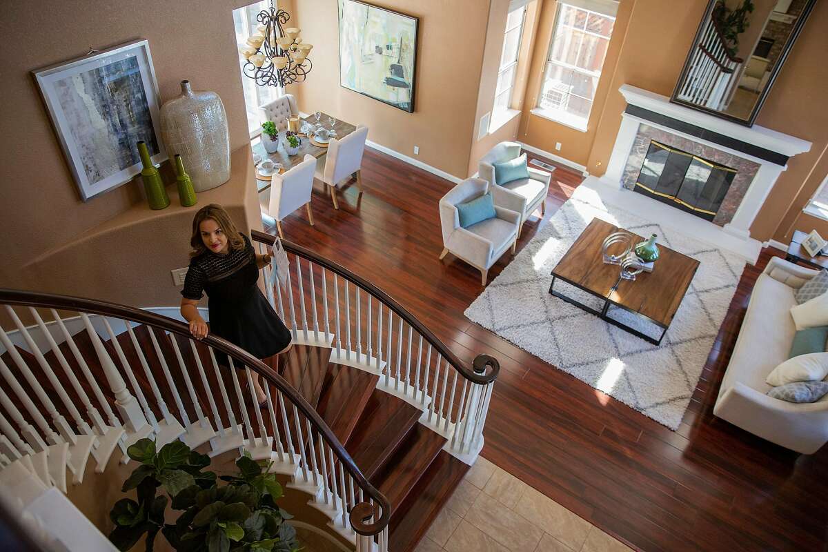 Erika Carrasco, a real estate agent at San Jose’s Intero Real Estate Services, visits a Silver Creek Valley Country Club home for sale.