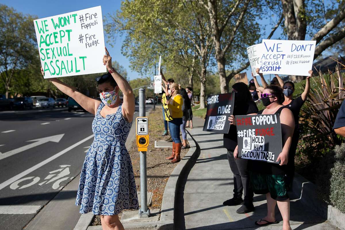 Sonoma County residents gather on the corner of Lakewood Drive and Old Redwood Highway in Windsor on April 9 to protest against Windsor Mayor Dominic Foppoli following the release of an investigation by The San Francisco Chronicle into multiple sexual assault accusations against Foppoli spanning decades.