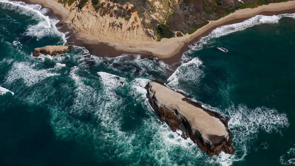 A view of the coastline between Watsonville and Half Moon Bay during a helicopter flight which was chartered to search for the remains of 12-year-old boy Arunay Pruthi who was pulled into the ocean over Martin Luther King weekend at Cowell Ranch State Beach on Monday, March 1, 2021 near Half Moon Bay, California.