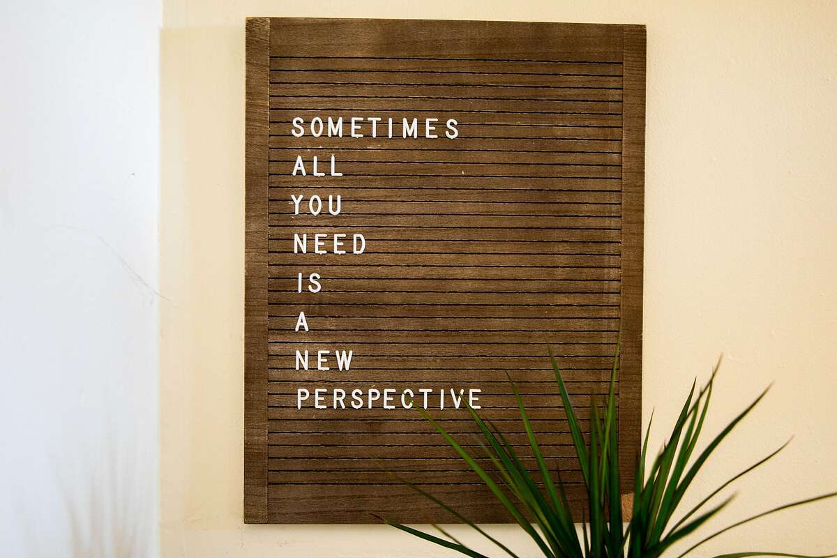 An inspirational sign hangs on the walls of therapist Stephanie McWoods’ Onyx Perspective Therapy office in Oakland.