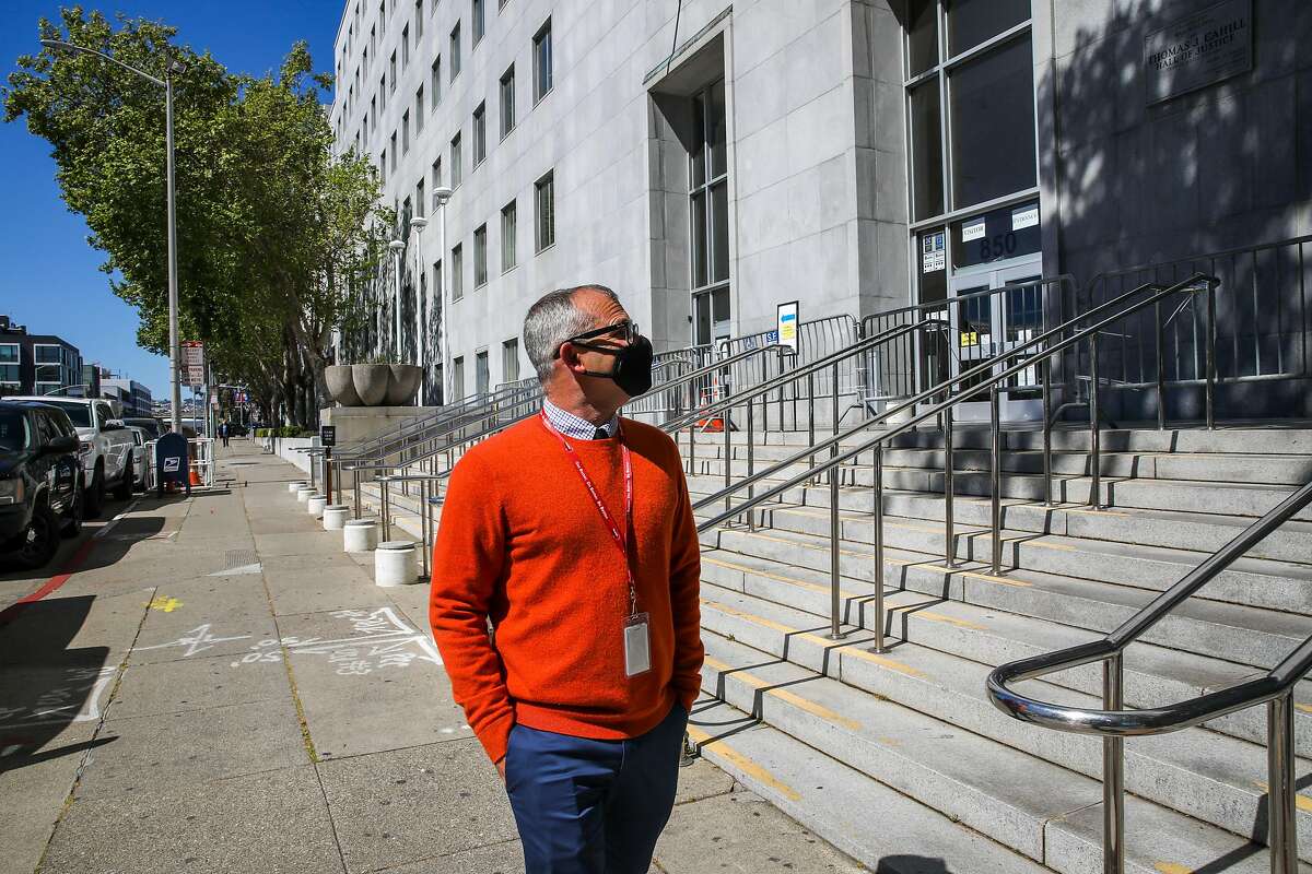 Gary McCoy, director of public affairs at HealthRight 360, walks outside the Hall of Justice, where he had served time in jail. Now in recovery for about 10 years, he’s telling the story for the first time of his years of homelessness and drug addiction.