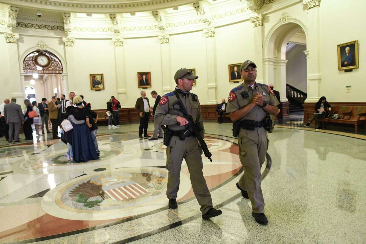 State law officers walk in the Texas Capitol as the legislature discusses permitless gun carry on Thursday, April 15, 2021.