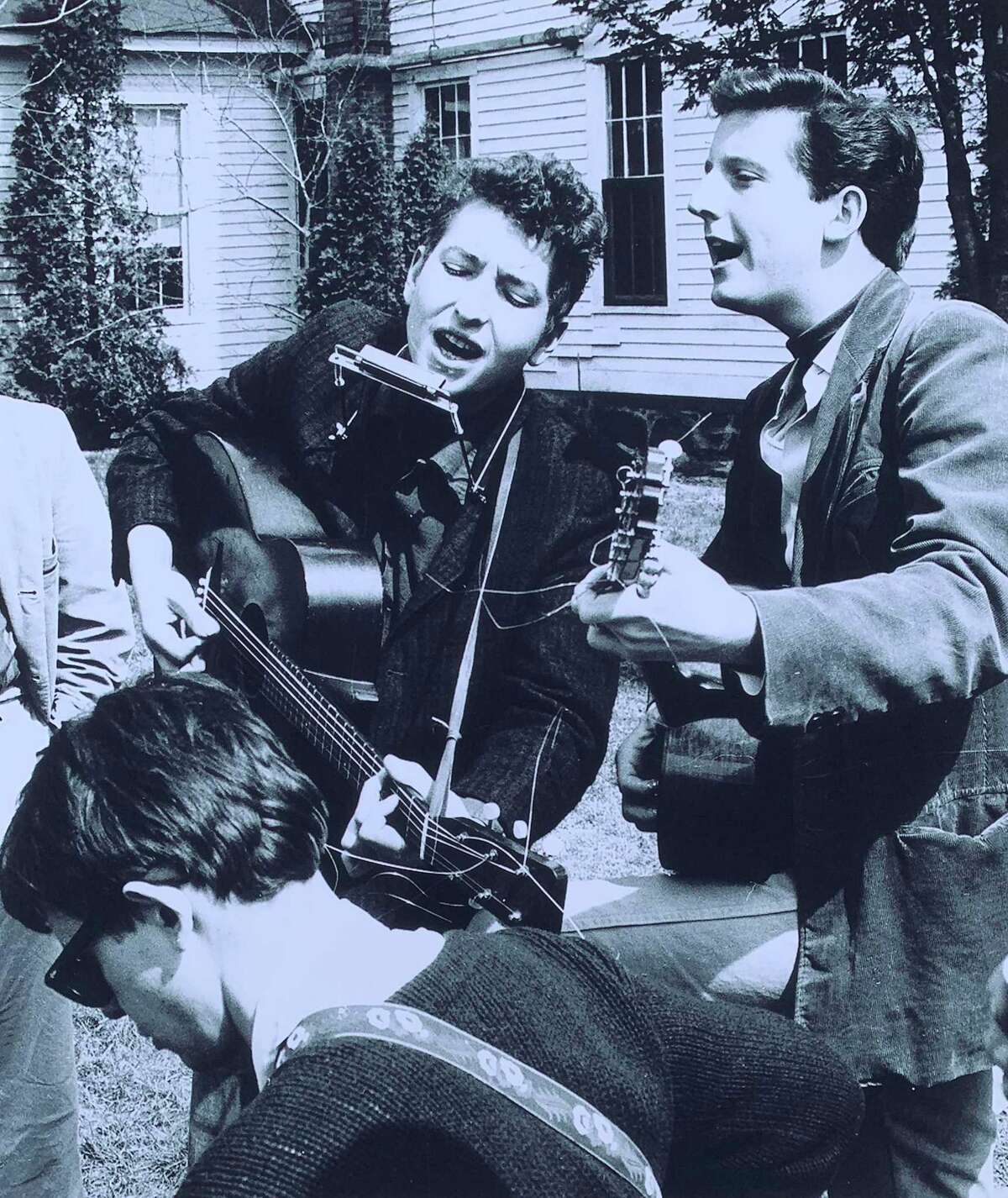 Bob Dylan, then 19, center, jams with Mark Spoelstra, right, and Bob Neuwirth, lower left, at the 1961 Indian Neck Folk Festival on May 6, 1961. The photo was taken by Stephen H. Fenerjian, a then-27-year-old Cambridge, Mass., photographer. Fernerjian now is 87 and living in Sharon, Mass.