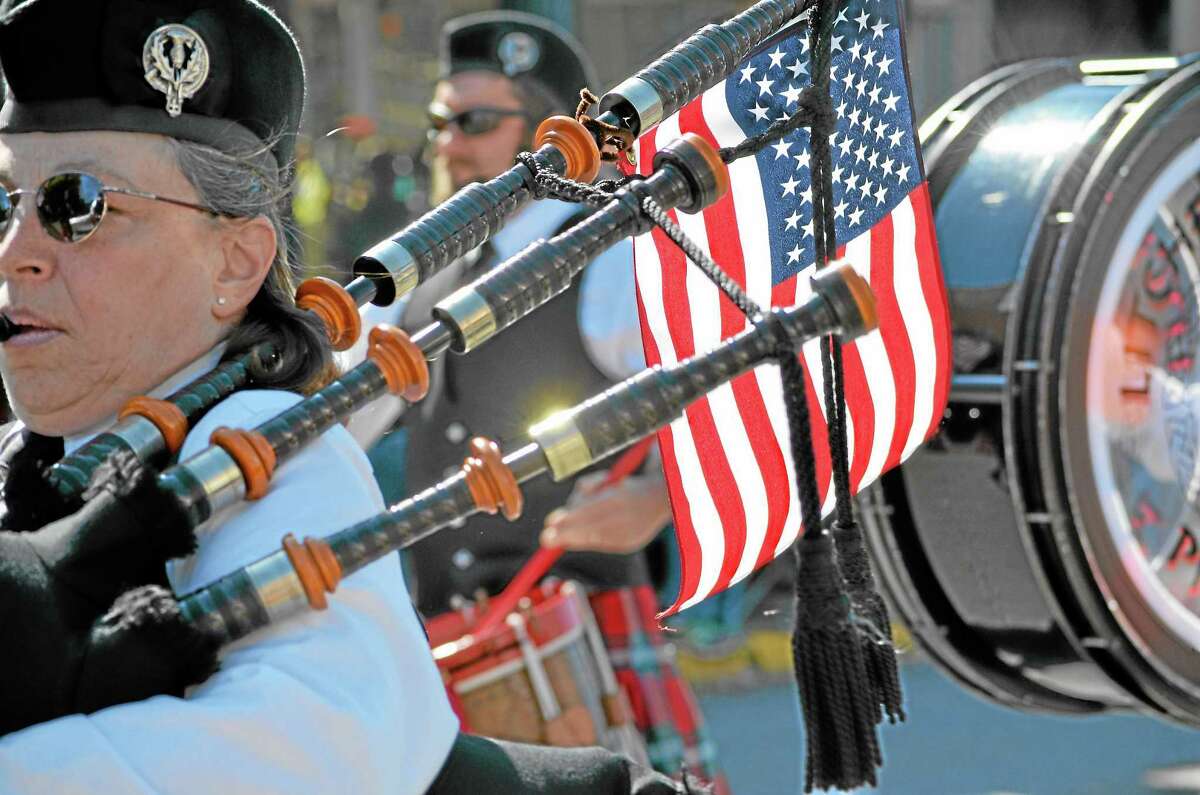 Tom Caprood/Register Citizen ¬ Members of the Litchfield Hills Pipe Band marched in Torrington's Memorial Day Parade.