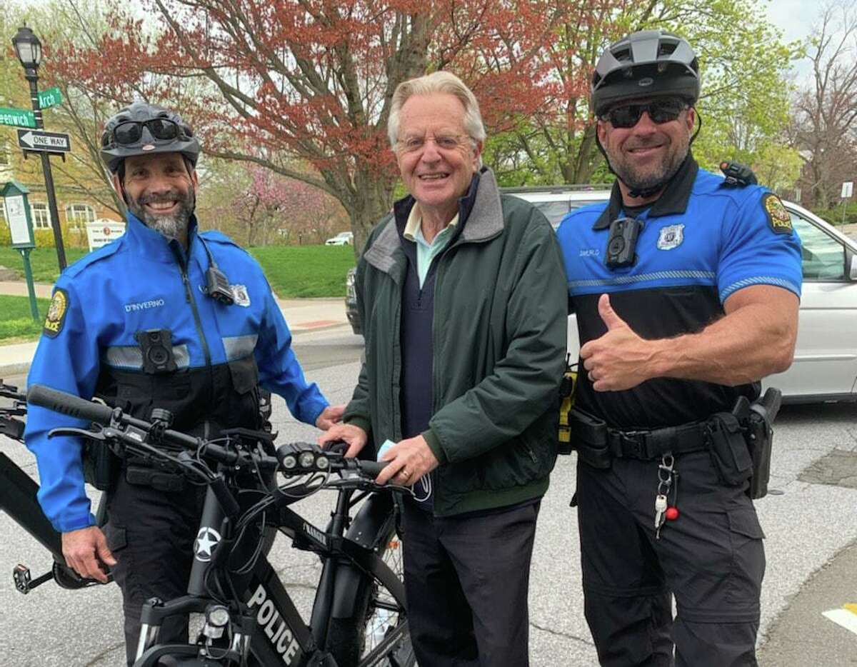 Talk show host Jerry Springer checks out the new equipment for the GPD's bike unit on April 30 on Greenwich Avenue. Greenwich Police Officers John D'Inverno and Robert Smurlo are part of the new community policing initiative. TV personality Jerry Springer, former host of 