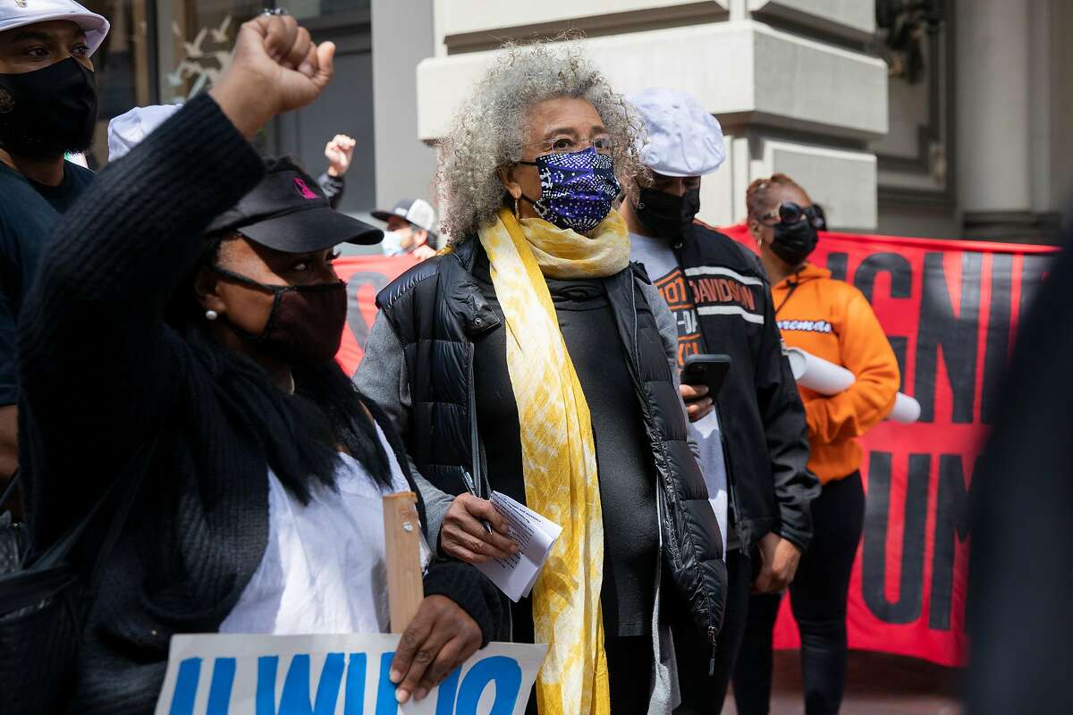Longtime social justice activist Angela Davis (center) attends the May Day demonstration in S.F.