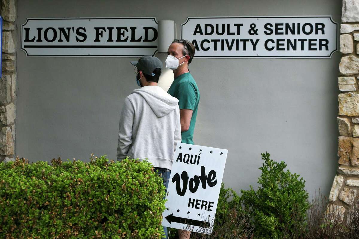 Two voters wait in line to vote in the May 2021 election at the Lions Field Adult & Senior Activity Center, 2809 Broadway St., on Saturday, May 1.