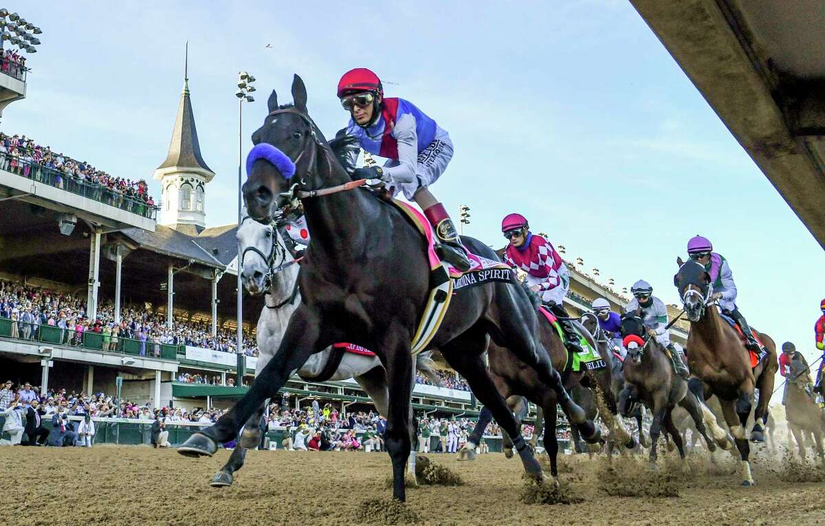 Medina Spirit with jockey John Velazquez aboard passes the finish line for the first time on the way to the win in the 147th running of The Kentucky Derby at Churchill Downs Race Track Saturday May 1, 2021 in Louisville, Kentucky. Photo Special to the Times Union by Skip Dickstein