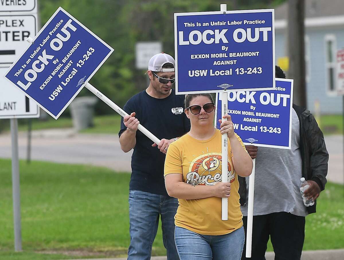 ExxonMobil and United Steel Workers Union members picket outside the plant Saturday afternoon after all the workers had been escorted out in a lockout. Photo made Saturday, May 1, 2021 Kim Brent/The Enterprise