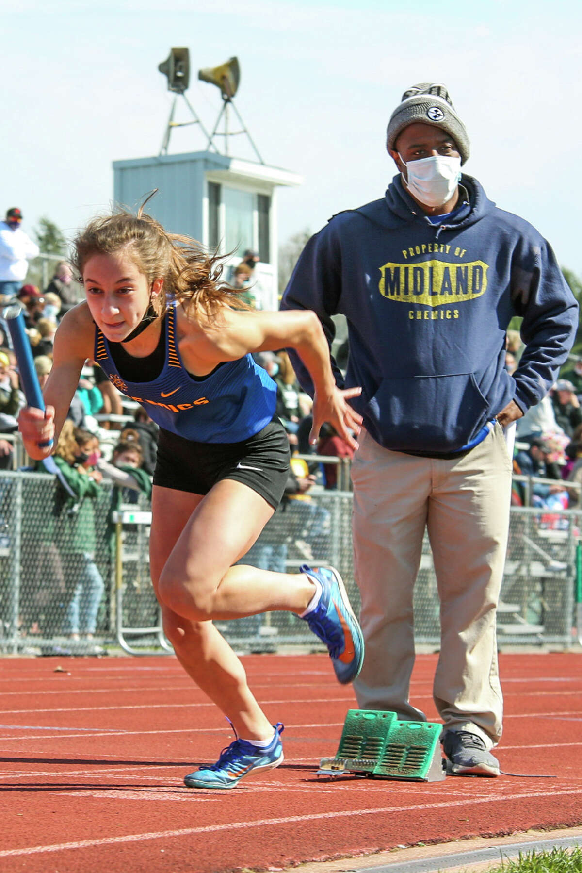 Midland's Kendall Wenzel competes in a relay during the Graves/Swayze Relays Saturday, May 1, 2021 at H. H. Dow High School. (Doug Julian/for the Daily News)
