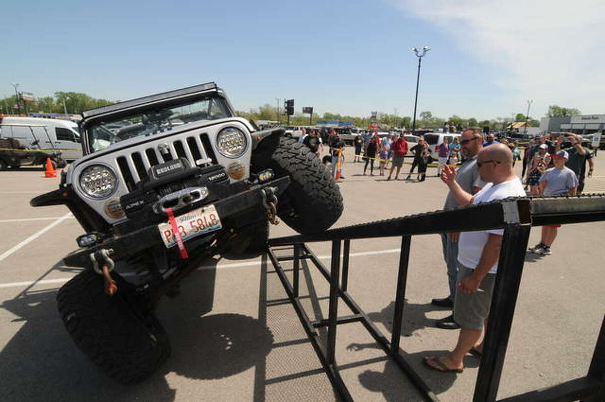 David Staszkiewicz of Edwardsville pushes his Jeep to the the limit during the Jeep Day Articulation Contest on Saturday in East Alton.