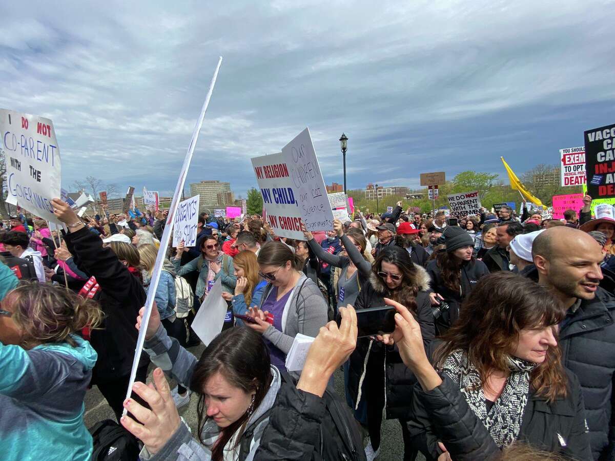 Thousands cheer for state Sen. Heather Somers, R-Groton, who would vote against the bill on mandatory school vaccinations Tuesday, April 27, 2021.