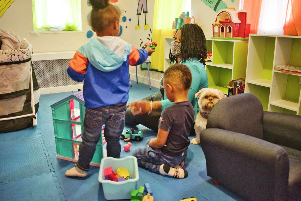 Analisa Sanchez spends time with Atreus, 2, left, and Damion, 4, at her daycare on Thursday, April 29, 2021, in Schenectady, N.Y. Preschool enrollment among three and four year olds dropped significantly from 2019 to 2020, U.S. Census data shows. (Paul Buckowski/Times Union)