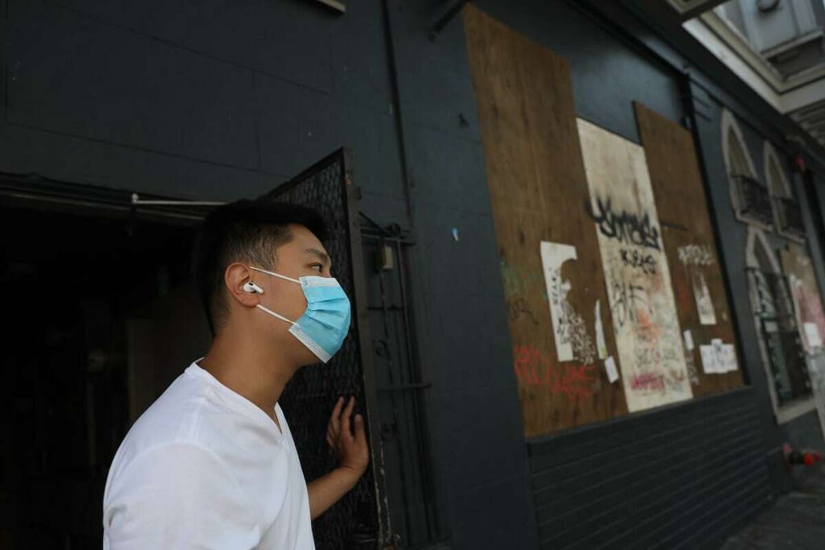 Jason Yu looks down 20th Street as he stands outside a side door to the commercial space on 20th Street that he has been trying to turn into an ice cream shop for 15 months on Wednesday, September 30, 2020 in San Francisco, Calif.