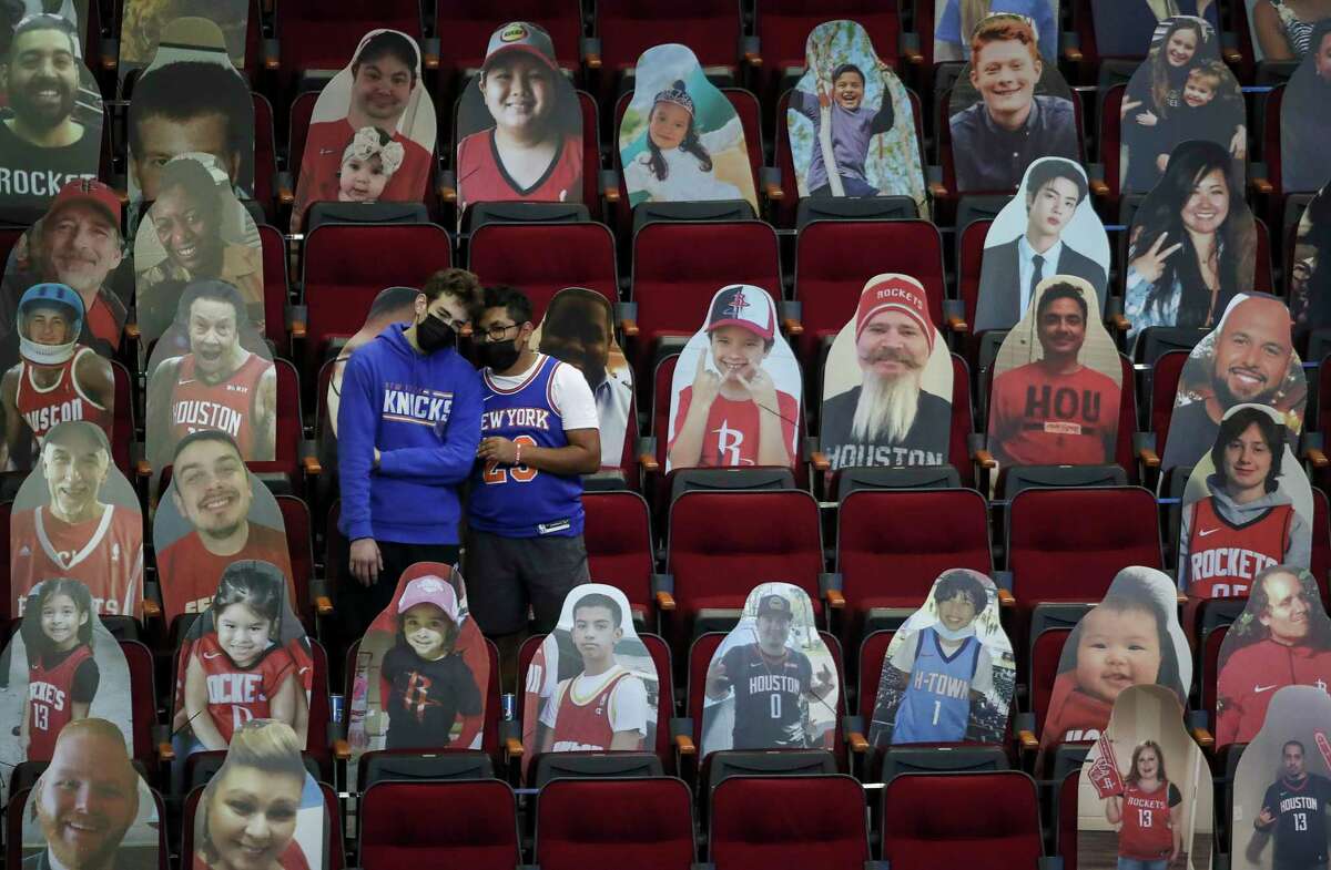 New York Knicks fans watch warmups before an NBA game between the Houston Rockets and the New York Knicks on Sunday, May 2, 2021, at the Toyota Center in Houston.