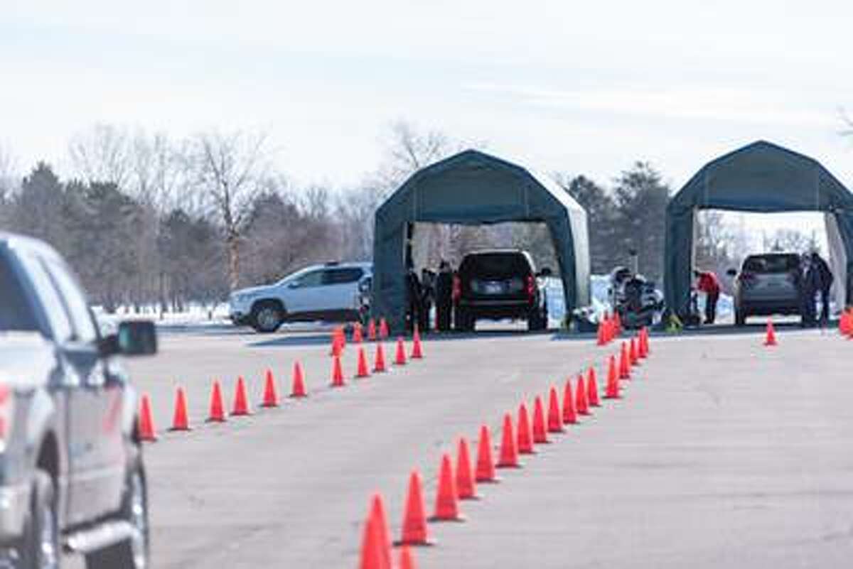 Vehicles line up for a "drop-in drive-in" COVID 19 vaccination clinic at Delta College. (Photo provided/ Delta College)