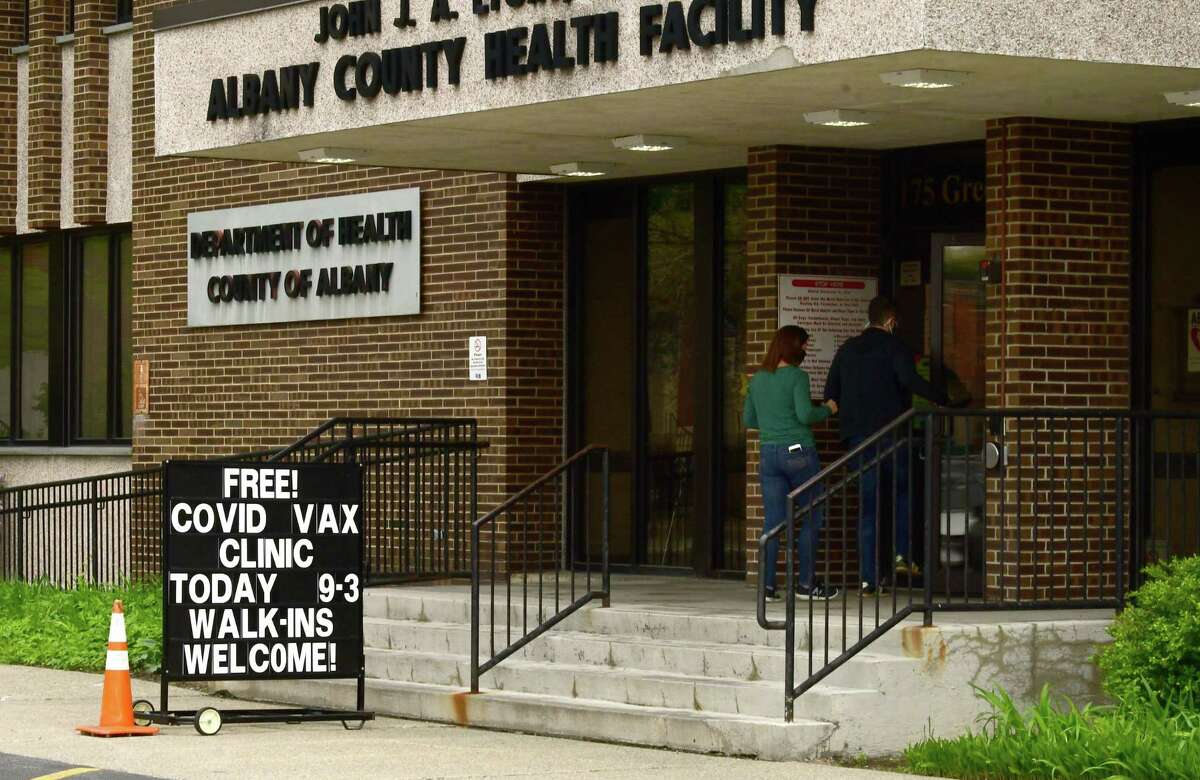 People walk into the County Department of Health at 175 Green St. during a free COVID-19 vaccine clinic on Monday, May 3, 2021 in Albany, N.Y. Deaths are increasing in August 2021 as the delta coronavirus variant impacts the unvaccinated. Government officials are urging residents to get vaccinated as soon as possible. (Lori Van Buren/Times Union)