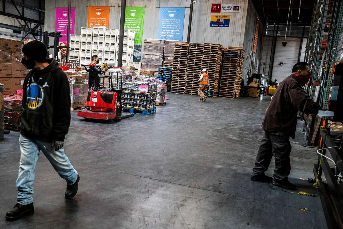 Workers in the warehouse at the San Francisco-Marin Food Bank.