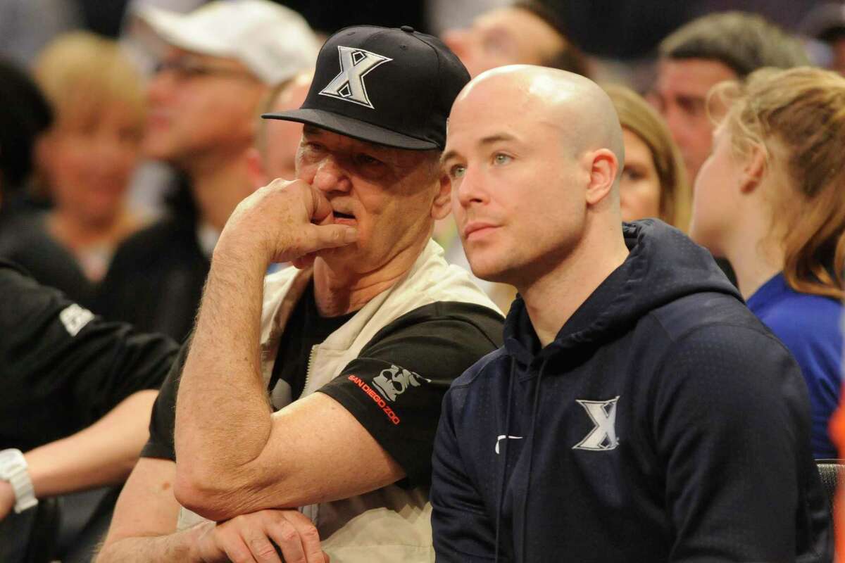Bill Murray with son Luke Murray, assistant coach of Xavier, watch a quarterfinal game of the Big East College Basketball Tournament between the Seton Hall Pirates and the Creighton Bluejays at Madison Square Garden on March 10, 2016 in New York.