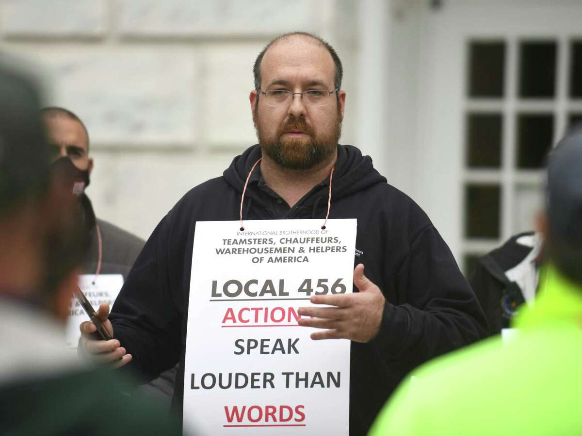 Julian Curtiss School custodian Chris Manuli speaks during the Teamsters Local 456 and Greenwich town employees protest outside Town Hall in Greenwich, Conn. Monday, May 3, 2021. Town essential employees state that they have been working to keep Greenwich running throughout the pandemic but its members have been without a contract for more than two years despite record real estate prices, tax revenue, and millions in federal aid.