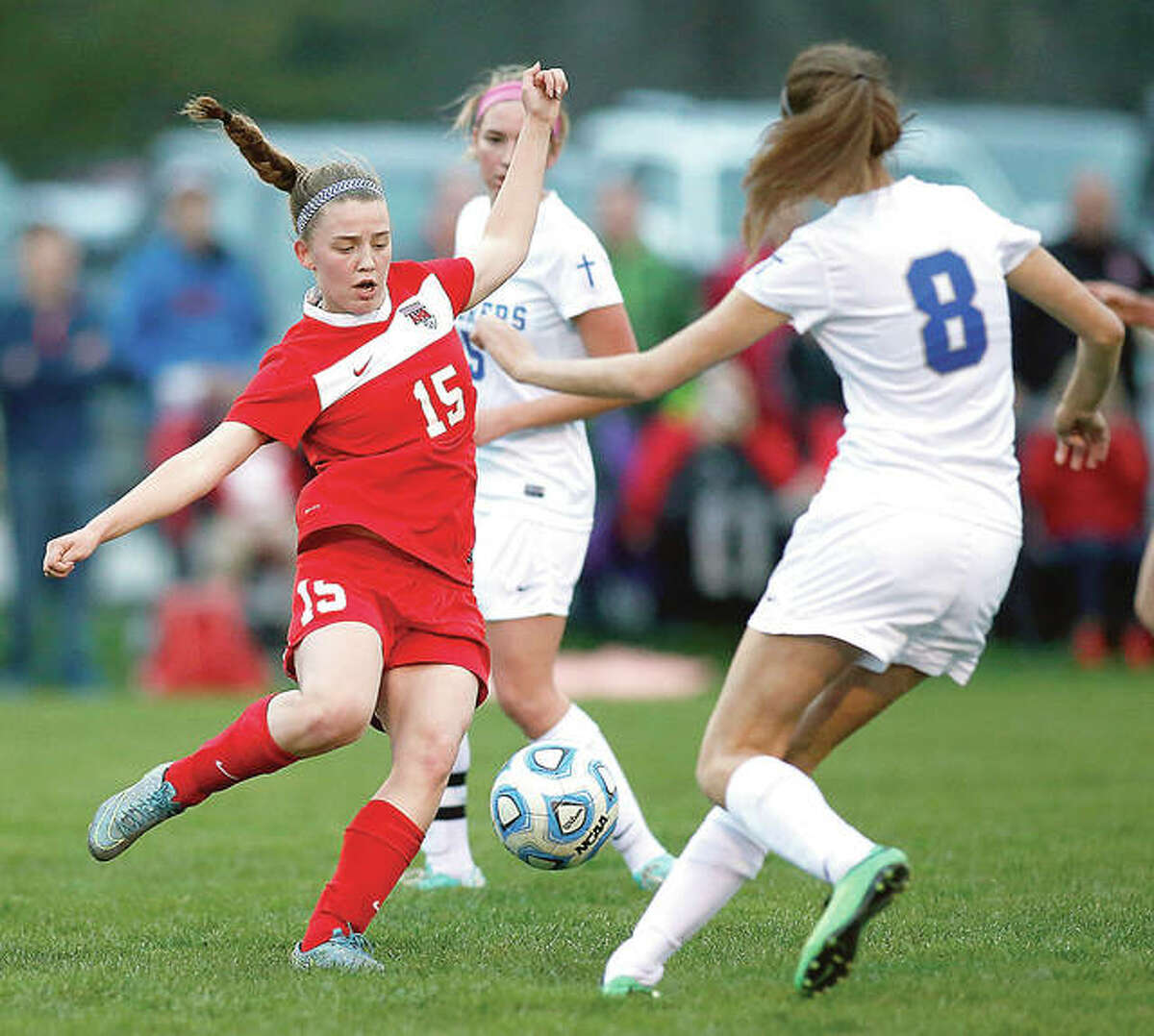 Alton’s Katie Kercher (15) and Marquette’s Kelsey Blasingham (8) battle for the ball during the 2016 game between the city rivals, the last time the Redbirds and Explorers played. Marquette and Alton will play each other for the first time since that game at 6 p.m. Wednesday at Public School Stadium.