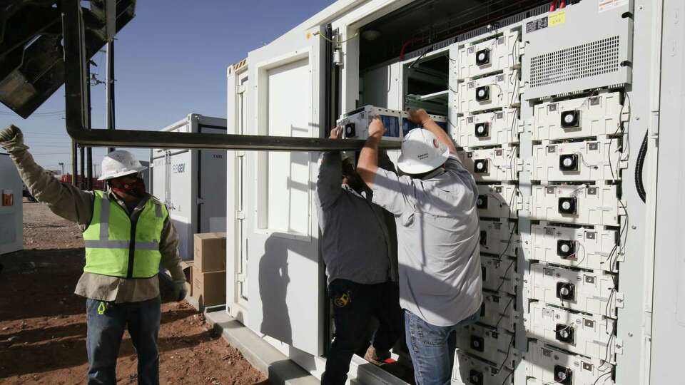 Workers install new utility-scale batteries at the new Broad Reach Power in Odessa. Broad Reach, which is based in Houston, was one of five companies to receive investments from EnCap Investments' first energy transition fund.