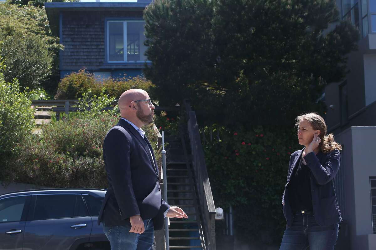 S.F. Supervisor Rafael Mandelman (left) and historian Shayne Watson talk in front of the former home of the late Phyllis Lyon and Del Martin.