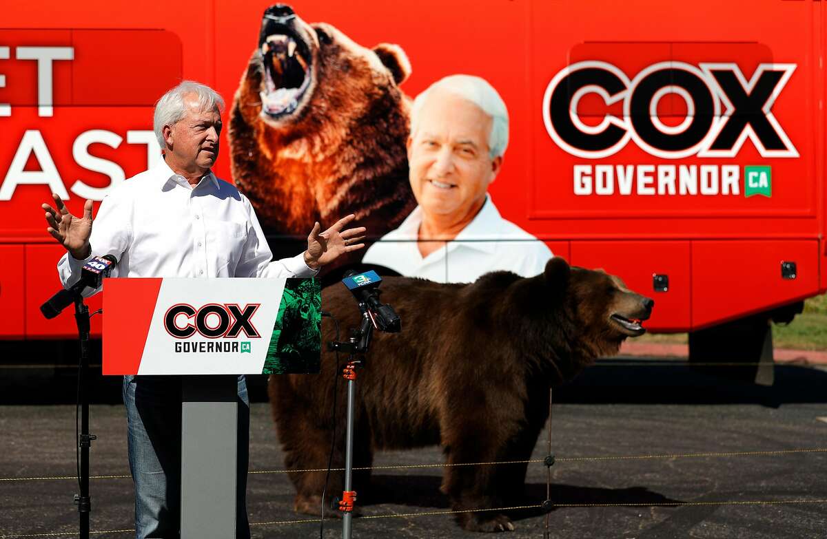 Gubernatorial hopeful John Cox campaigns with a 1,000-pound bear as a prop at Miller Regional Park in Sacramento.