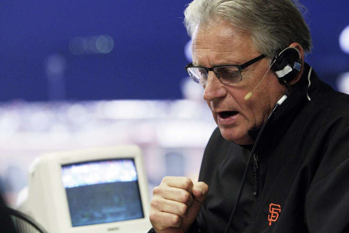 Giants broadcaster Duane Kuiper reads an announcement between innings as he and Dave Flemming call the game from the KNBR radio booth as the San Francisco Giants played the Oakland Athletics in a pre-season game at AT&T Park in San Francisco, Calif., on Thursday, March 27, 2014. Broadcasters throughout the game are bombarded by countless statistics which dissect a player's success to the finest detail. While some broadcasters use them, others prefer call their games with good old fashioned research done firsthand.