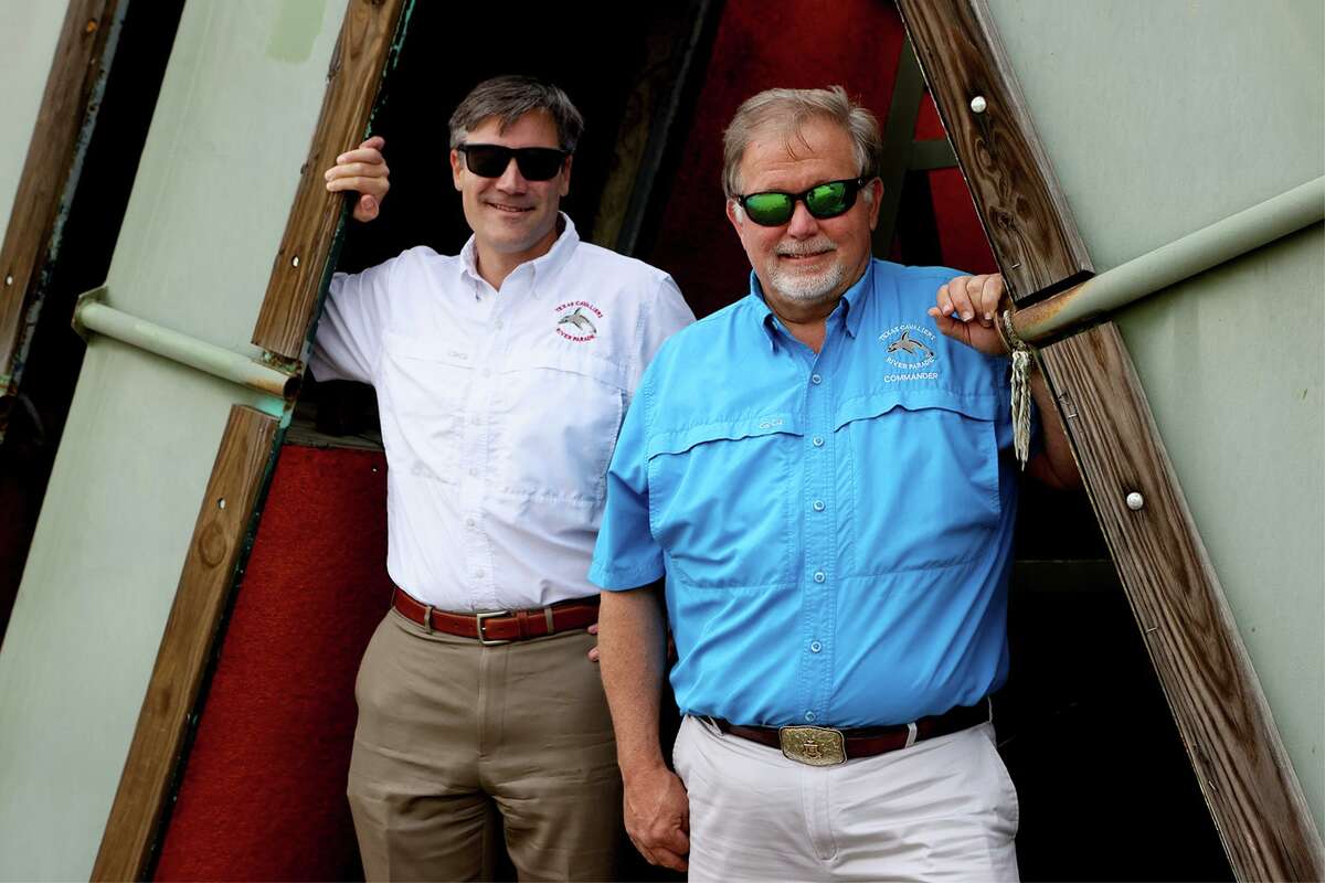 Barton T. Simpson, right, commander of the Texas Cavaliers, and Gardner Peavy, River Parade vice marshall, stand beside empty barges waiting to be used for the 2021 River Parade at Bell Hydrogas on S.E. Military Drive Tuesday.