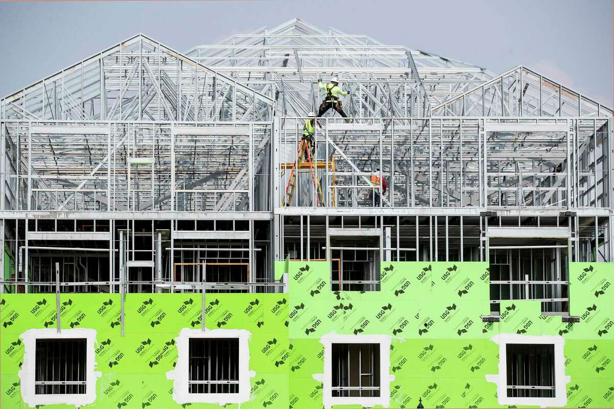 Construction workers build a multi-family complex on Tuesday, May 4, 2021 in Missouri City. Texas continues to lead the United States in raw population growth, according to Census estimates released Tuesday. The state’s suburbs also continued swelling. Collin and Denton counties are projected to have larger population increases than Harris County, for example. Meanwhile, Fort Bend County is expected to record the sixth-largest population increase in the country. There were 373,965 more Texas residents in 2020 than in 2019 — marking the biggest increase since 2017 — according to the estimates, which don’t incorporate the 2020 Census results.