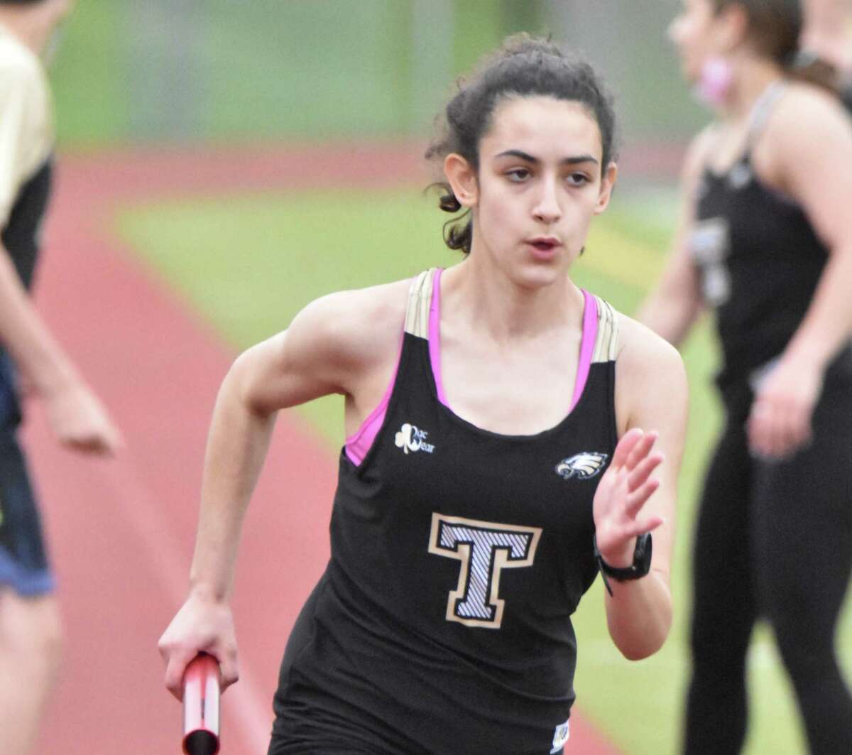 Evelyn Marchand won the 400 and 3200 meters and was a member of the winning 4x400 meter relay team in Trumbull's meet with Stamford.