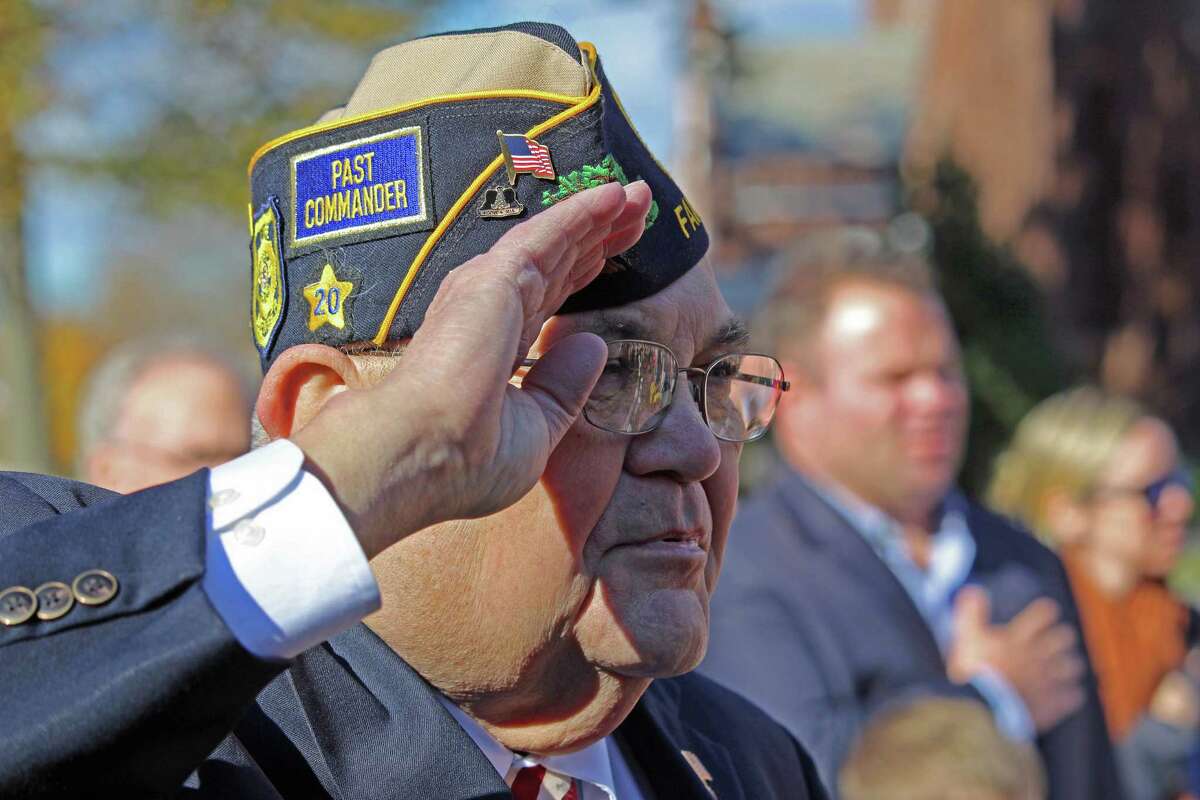 Thomas Quinn salutes the flag at the start of Friday's Veterans Day ceremonies in Fairfield. Fairfield, CT. 11/11/16