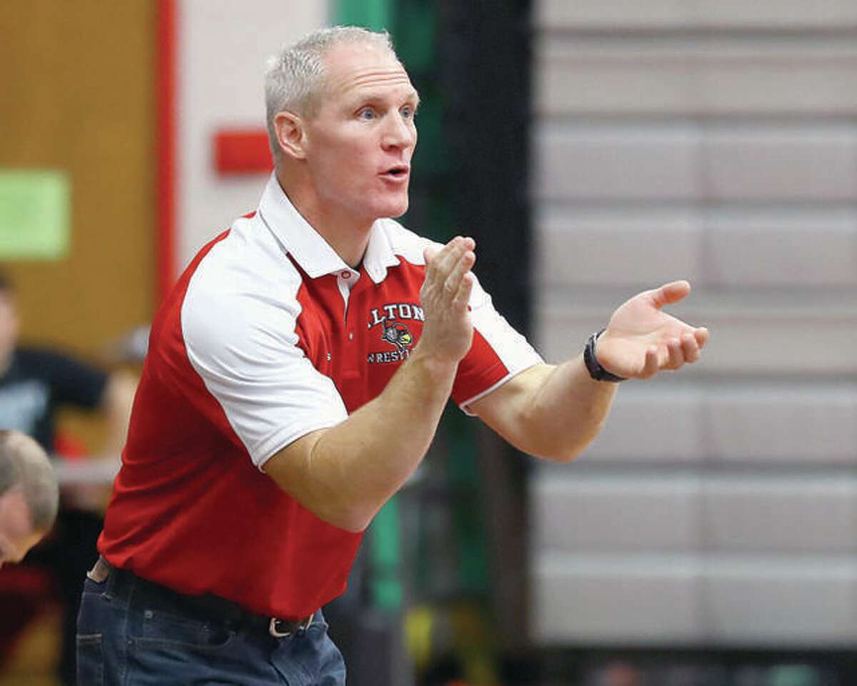 Alton wrestling coach Eric Roberson's Redbirds are 8-4 in dual action and will take part in the annual Red Schmitt Holiday Tournament Thursday and Friday at Granite City.
