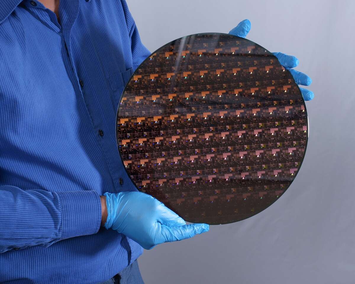 A 12-inch silicon wafer with IBM's new 2 nanometer chips that were developed at its research lab at Albany Nanotech.