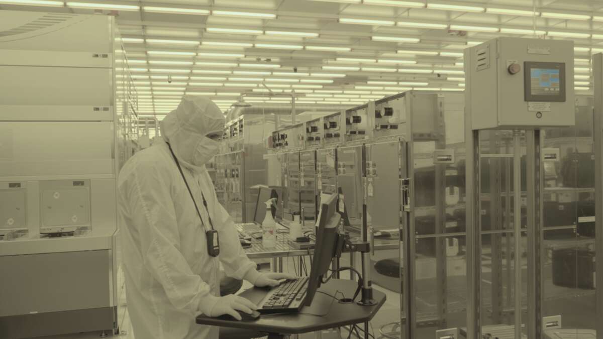 A scientist in the clean room at IBM Research's lab at Albany Nanotech