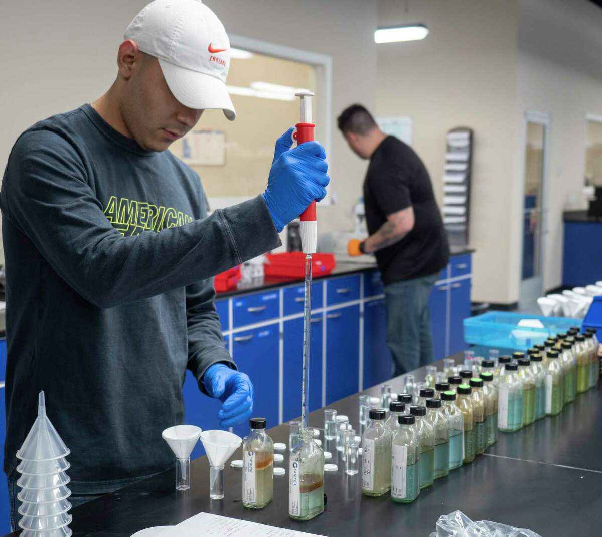 Evan Ortiz, lab tech with Jacam Catalyst, checks samples in the lab with analysis available in one or two days for oil field work. 05/05/2021 Tim Fischer/Reporter-Telegram