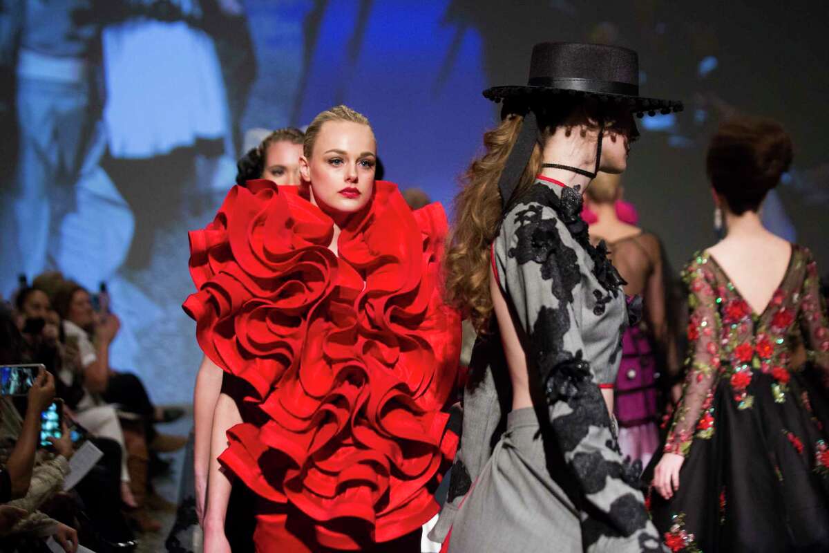 A model wears a red design by Ebonie Sophus called Oscar de las Ruffles at the Fashion Fusion 2018, Thursday, Jan. 11, 2018, in Houston.