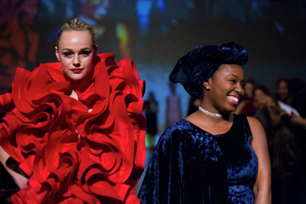 Ebonie Sophus next to her design called Oscar de la Ruffles at the Fashion Fusion 2018. 