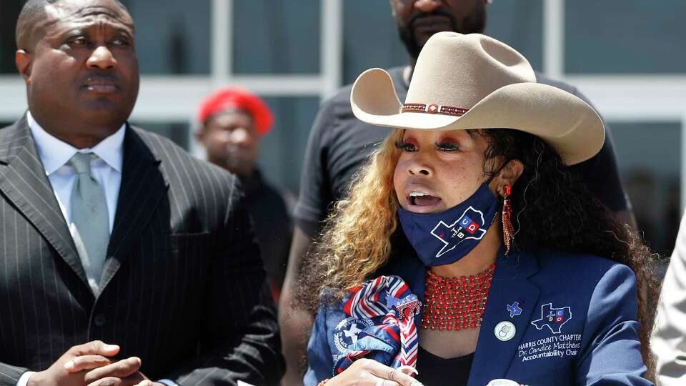 Dr. Candice Matthews, TCBD Accountability Statewide/Harris County Chair speaks to the media with Quanell X during a press conference at the Galveston Law Enforcement Center, Wednesday, May 5, 2021, in Galveston. The Texas Coalition Of Black Democrats organized a 