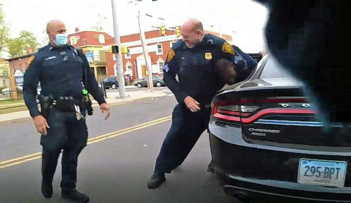 Body camera footage shows Sgt. Sean Lynch, right, restraining a suspect during an arrest on Sunday.