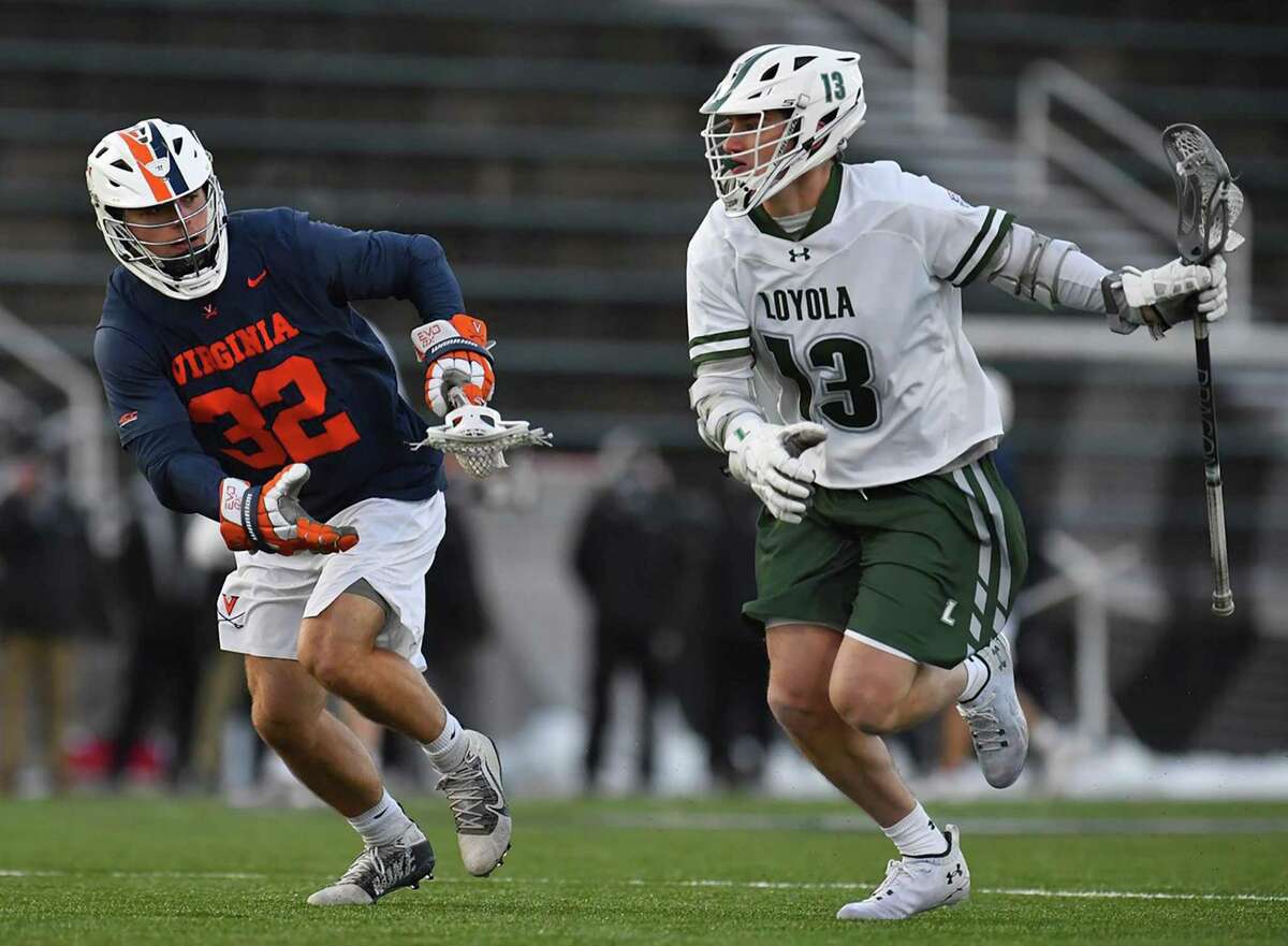 New Canaan’s Peter Swindell (13) of the Loyola-Maryland men’s lacrosse team in action against Virginia during a game on Feb. 20.
