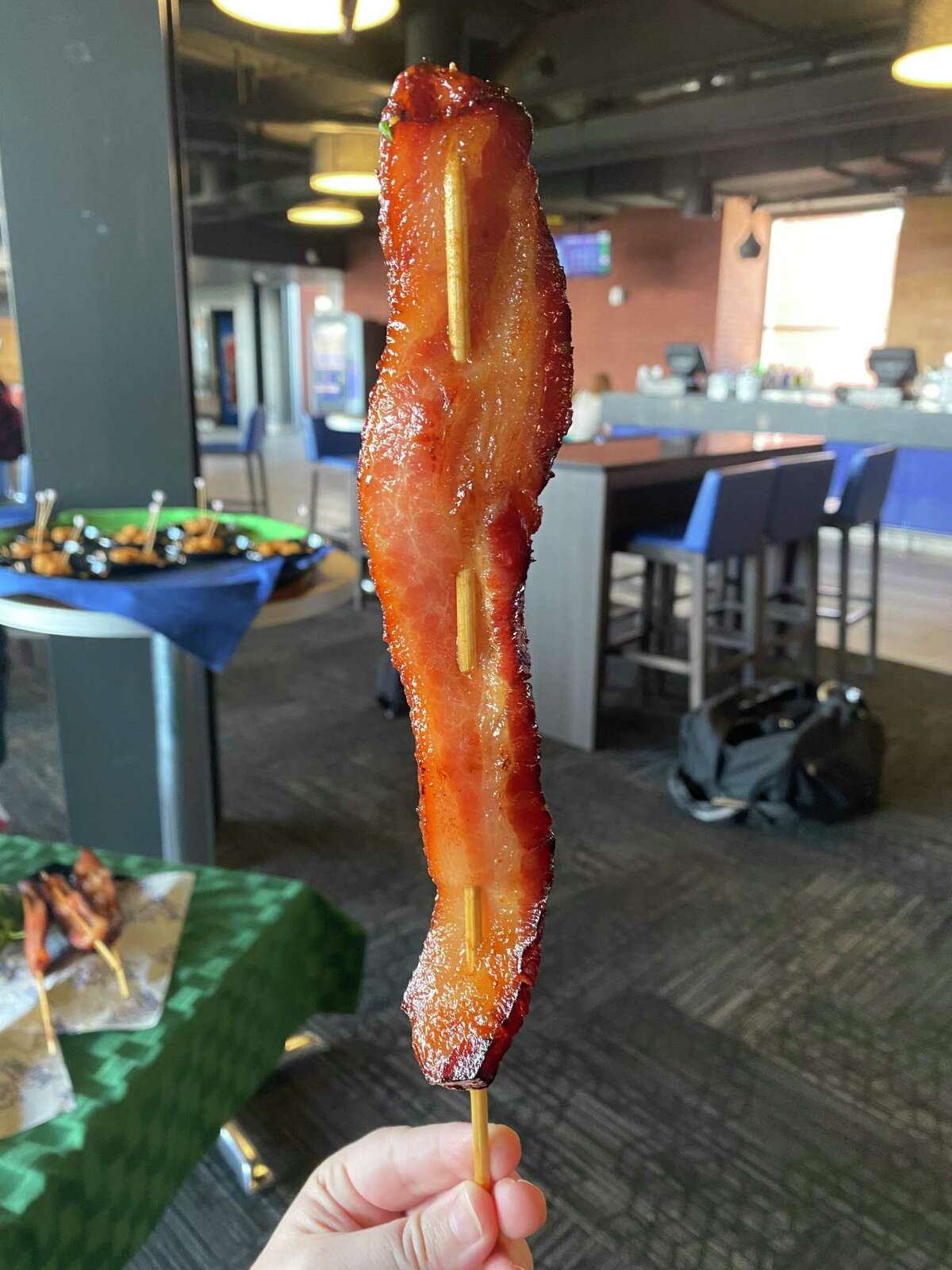 Bacon steaks ($7.75) “Basically a large slab of bacon on a stick,” Patterson said. “Easy to handle when you’re out there watching the game.” The speared bacon is candied, baked with brown and granulated sugars and seared off on a flattop grill.