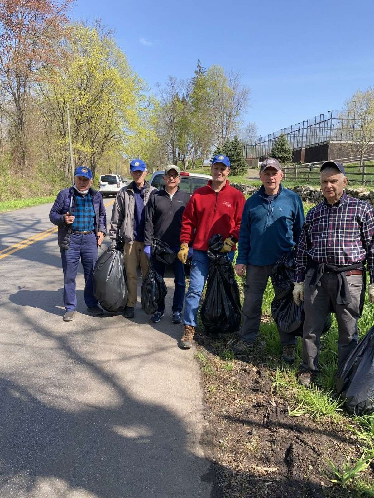 Members of the New Canaan Exchange Club, and families worked to pick up and dispose of trash on Lapham Road on the west side of Waveny Park this past Saturday, April 24. A pickup truck full of refuse was removed from the roadside. Exchange Club members in this photo are: Gene Milosh, Bob Williams, Charles Taben, Steve Root, Mike Mimnaugh and Mike Gregorio. Luke Tashjian organized this year’s, 2021, effort, and provided coffee, and donuts for the team.